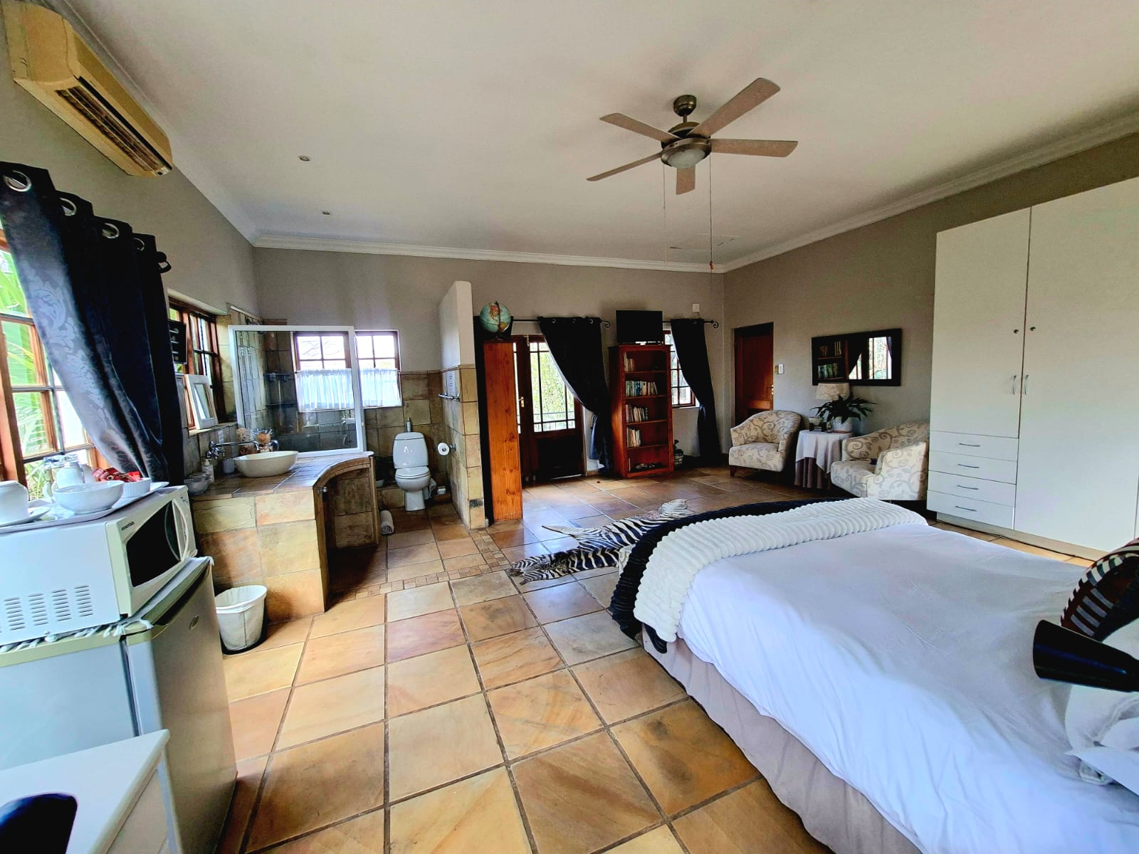 Snap Dragon Suite bedroom and open bathroom