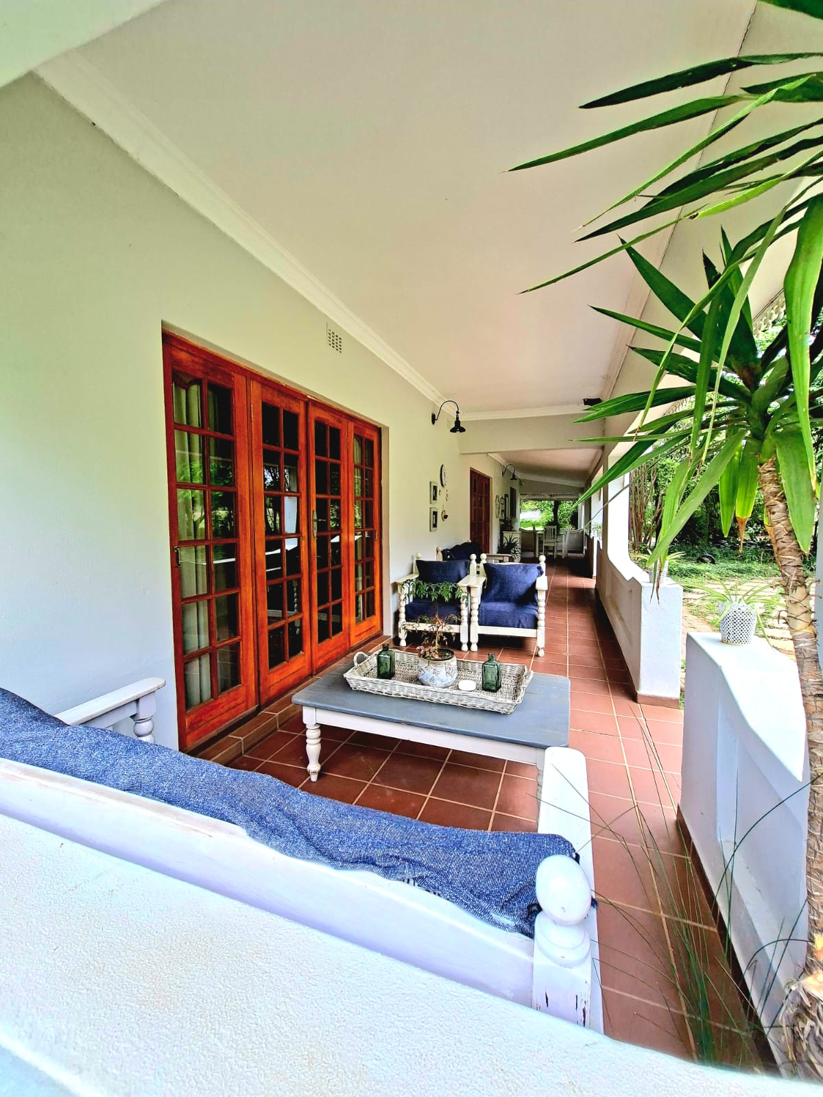 Lodge veranda with seating and garden views